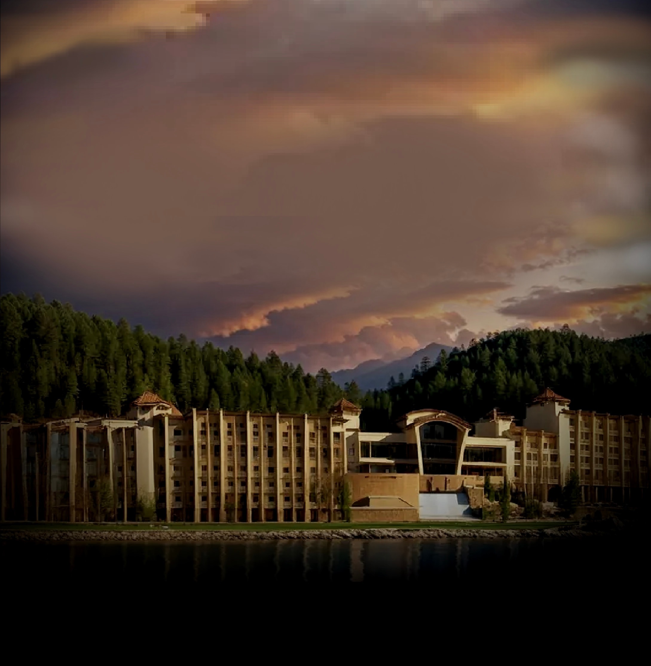 Inn of the Mountain Gods Resort & Casino beneath a dramatic mountain sunset